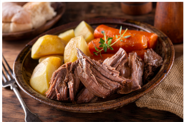 Dinner served with beef pot roast, no salt added, potatoes and carrots.