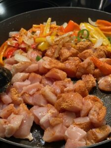 Chicken added to sauteed vegetables for Low Sodium Tex-mex recipe