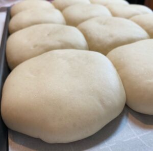 Puffy hamburger buns after letting them rise