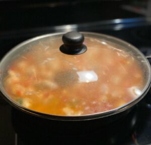 Low Sodium Taco Chicken and Rice Simmering on Stove